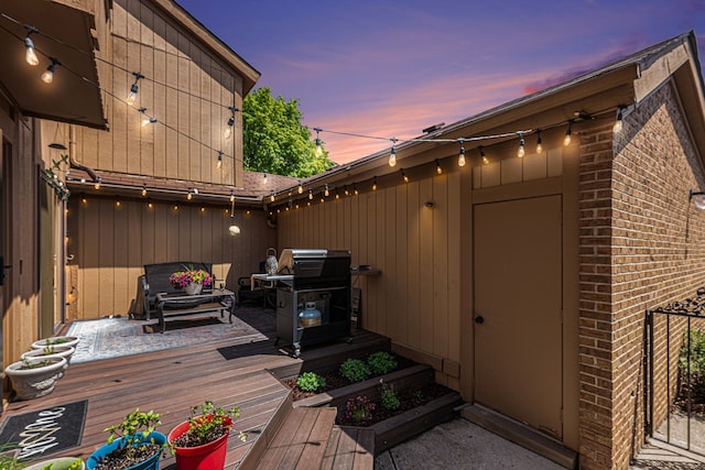 deck featuring a grill