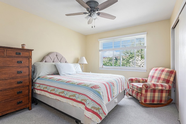 bedroom featuring carpet flooring, a closet, and a ceiling fan