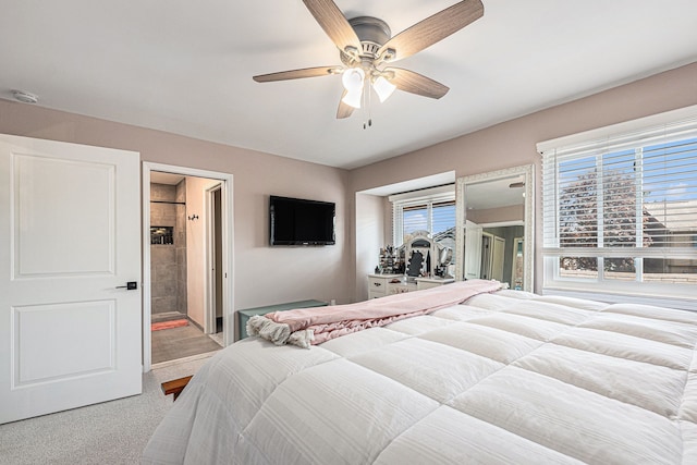 bedroom featuring carpet flooring, ceiling fan, access to outside, and ensuite bath