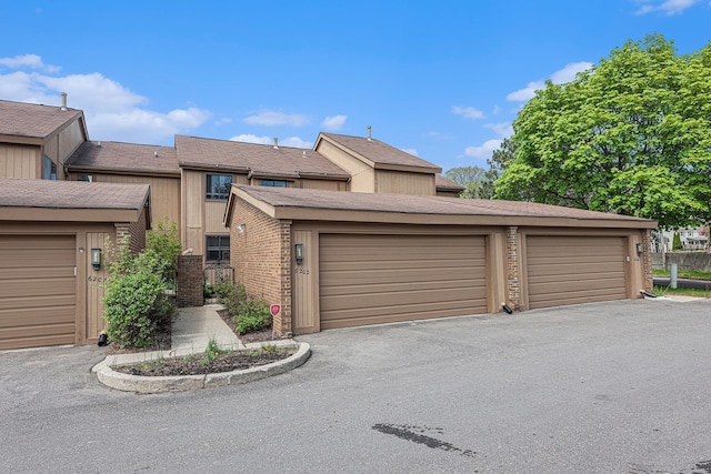 view of front of property featuring community garages
