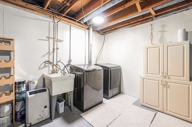 washroom with washer and dryer and cabinet space