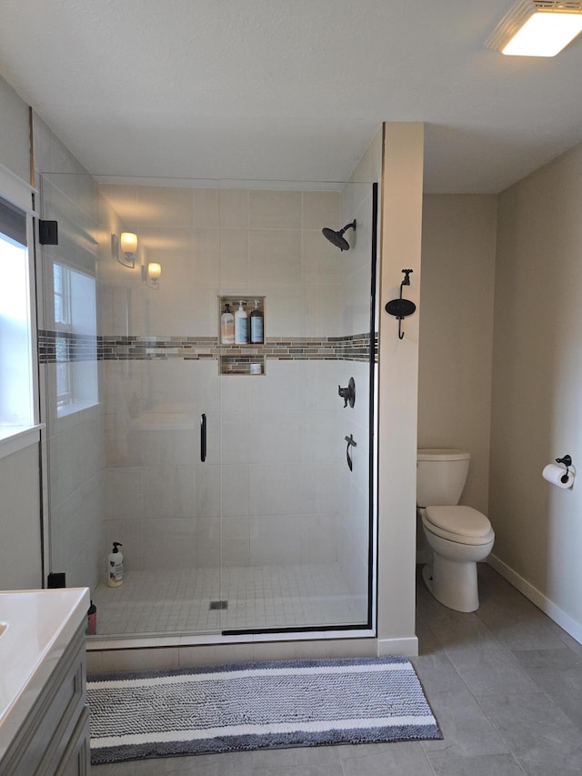 567 Angler Ave, Coldwater, MI 49036 - full bath featuring a stall shower, toilet, tile patterned flooring, and baseboards