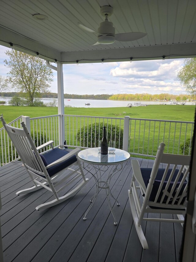 567 Angler Ave, Coldwater, MI 49036 - wooden deck featuring a water view, ceiling fan, a yard, and a porch