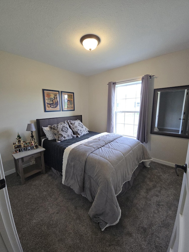 567 Angler Ave, Coldwater, MI 49036 - carpeted bedroom with a textured ceiling and baseboards