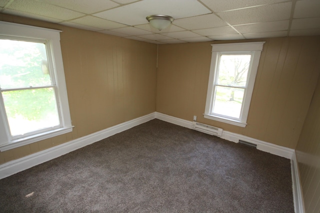130 W Paterson St, Kalamazoo, MI 49007 - spare room with a baseboard heating unit, dark colored carpet, a paneled ceiling, and baseboards