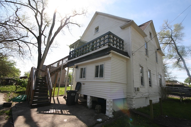 130 W Paterson St, Kalamazoo, MI 49007 - view of property exterior with stairs and a balcony