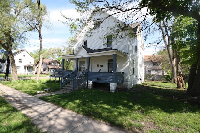 130 W Paterson St, Kalamazoo, MI 49007 - view of front of house with a porch and a front lawn