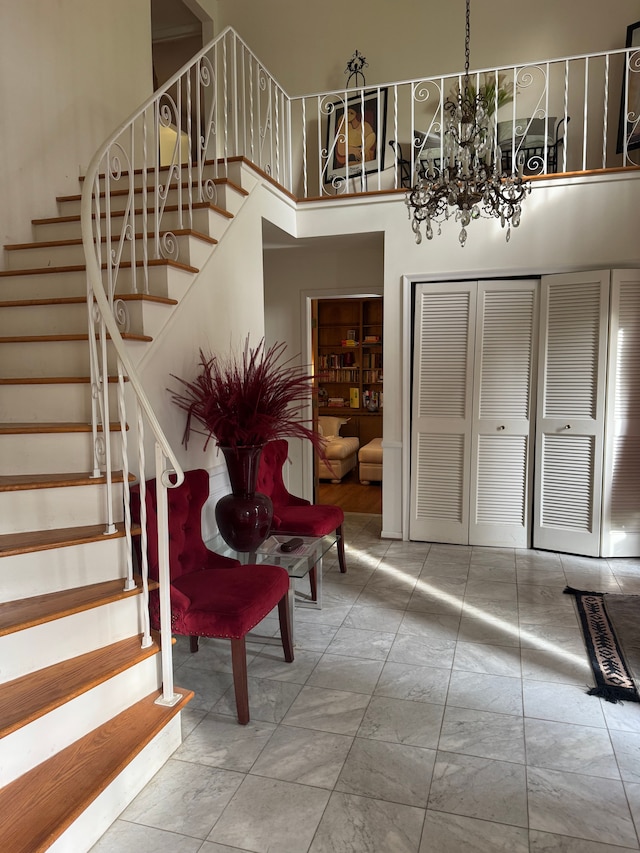 5819 Raven Rd, Bloomfield Hills, MI 48301 - foyer with stairway, a chandelier, a towering ceiling, and marble finish floors