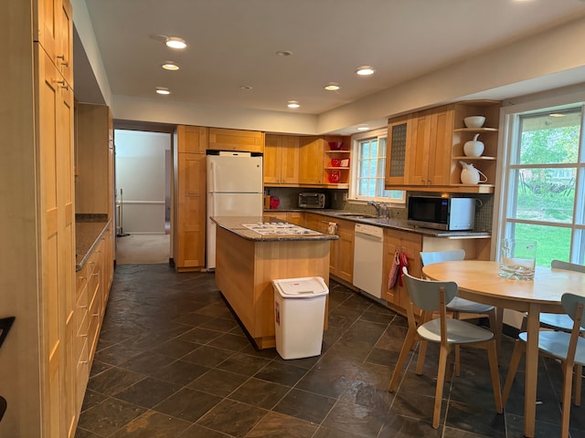 kitchen with open shelves, white appliances, a kitchen island, a sink, and backsplash