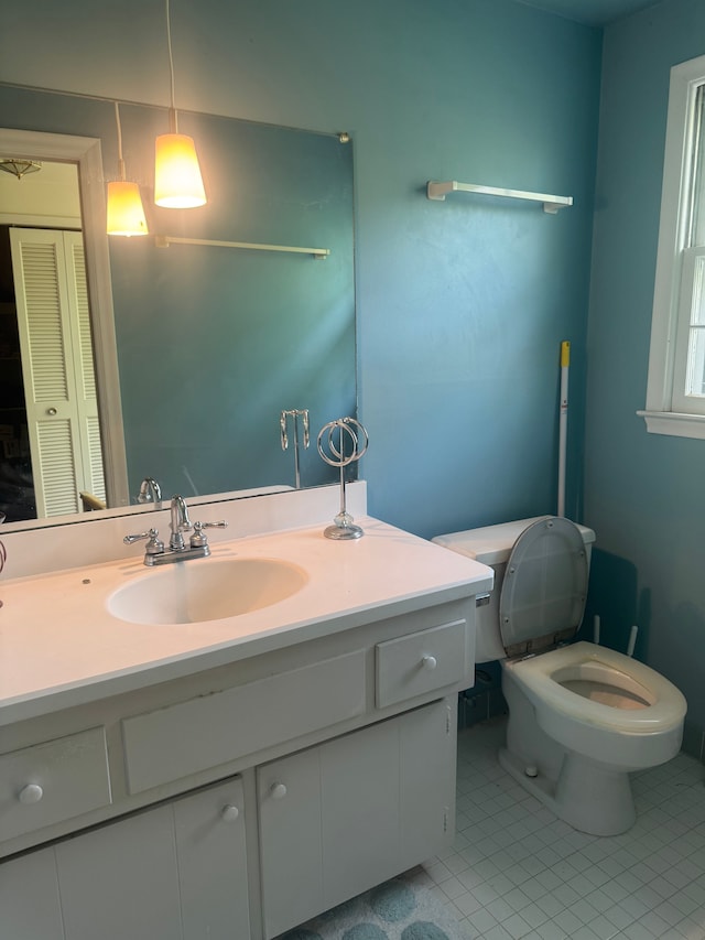 5819 Raven Rd, Bloomfield Hills, MI 48301 - bathroom featuring vanity, toilet, and tile patterned flooring