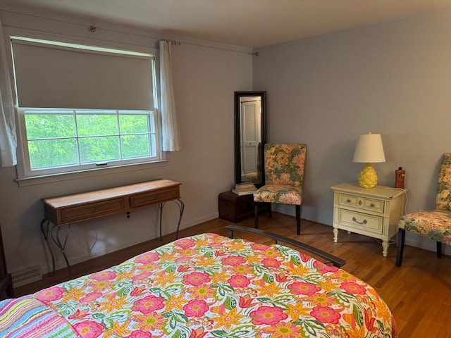 bedroom featuring wood finished floors