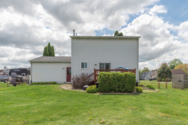 rear view of house with a wooden deck