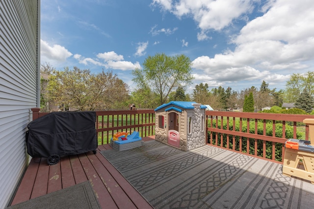 wooden deck featuring grilling area