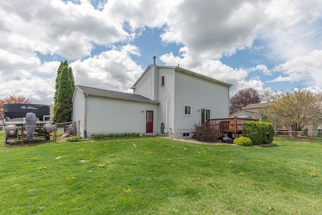 back of house with a wooden deck