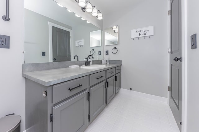 bathroom with vanity, tile patterned flooring, and toilet