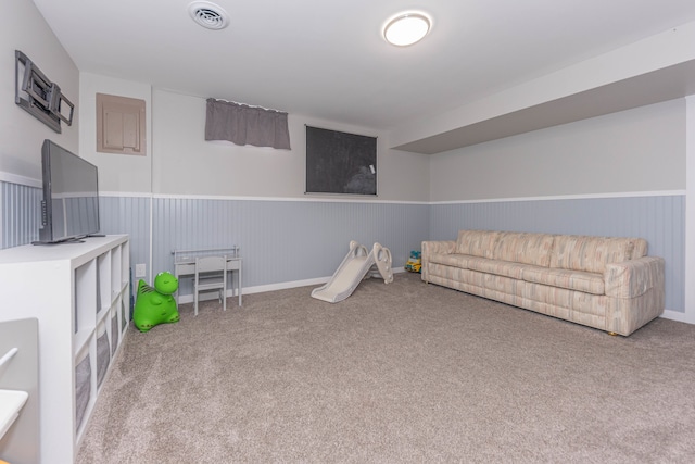 recreation room featuring carpet and wainscoting