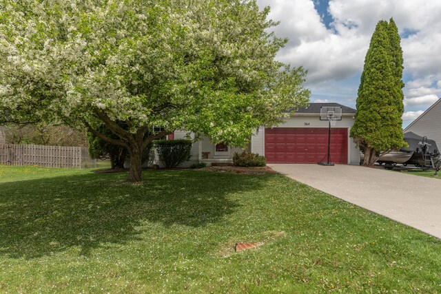 obstructed view of property with an attached garage and concrete driveway