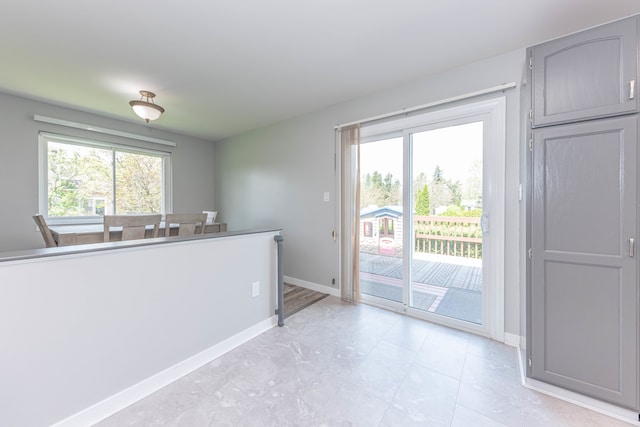 kitchen with gray cabinets and baseboards