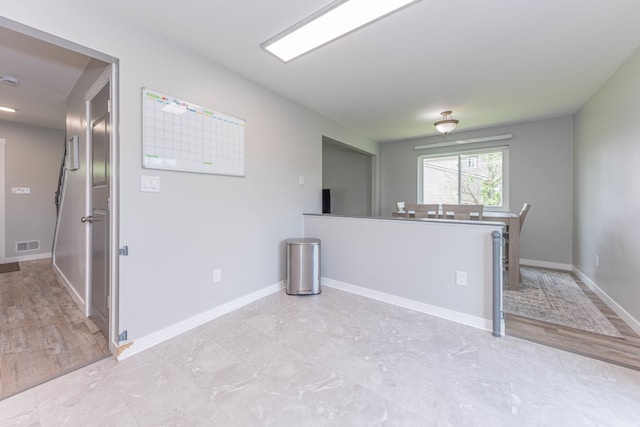 empty room featuring baseboards