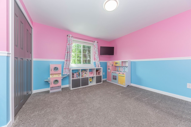 playroom featuring carpet and baseboards