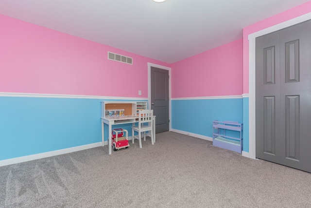 rec room featuring carpet floors and baseboards