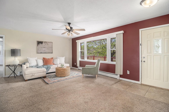 living room featuring a baseboard radiator, ceiling fan, baseboards, carpet floors, and a textured ceiling