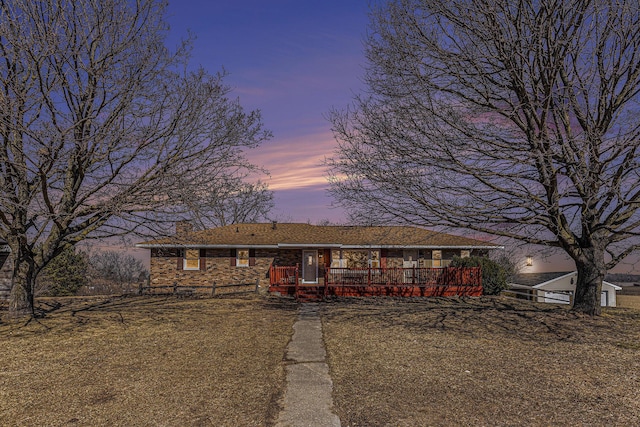 ranch-style home featuring a chimney