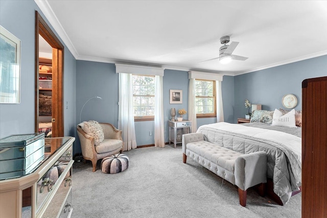 bedroom featuring crown molding, carpet, ceiling fan, and baseboards