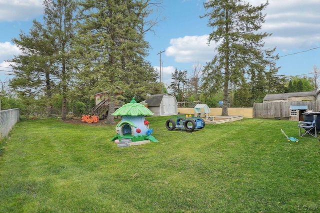 2905 Marshall St, Ann Arbor, MI 48108 - view of yard with a storage unit and an outbuilding