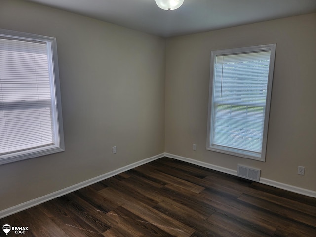 442 Beach St, Mount Morris, MI 48458 - spare room with dark wood-type flooring and baseboards