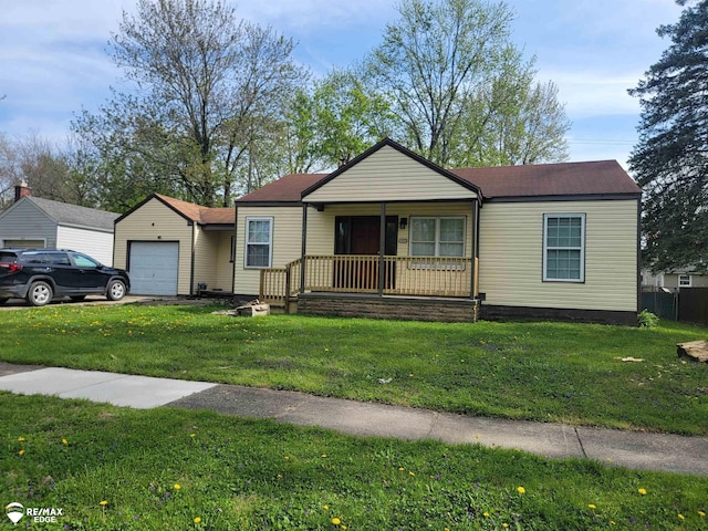 442 Beach St, Mount Morris, MI 48458 - view of front of property featuring a garage, a porch, and a front lawn