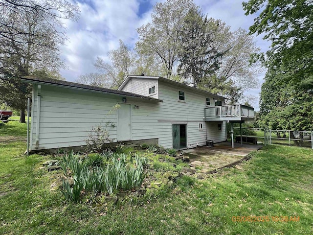 7744 Clairmont Rd, Onsted, MI 49265 - rear view of house featuring a wooden deck and a patio