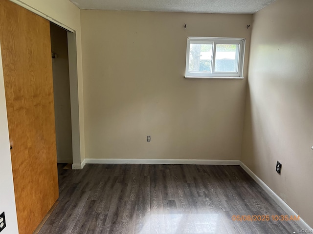 7744 Clairmont Rd, Onsted, MI 49265 - unfurnished bedroom featuring wood finished floors and baseboards