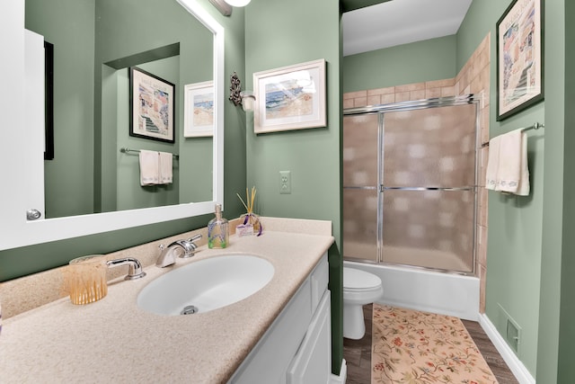 1704 Cassady Place Dr, Plymouth, MI 48170 - full bath featuring toilet, vanity, enclosed tub / shower combo, and wood finished floors
