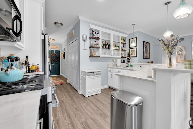 1704 Cassady Place Dr, Plymouth, MI 48170 - kitchen featuring black microwave, a peninsula, open shelves, stainless steel gas range oven, and light wood-type flooring