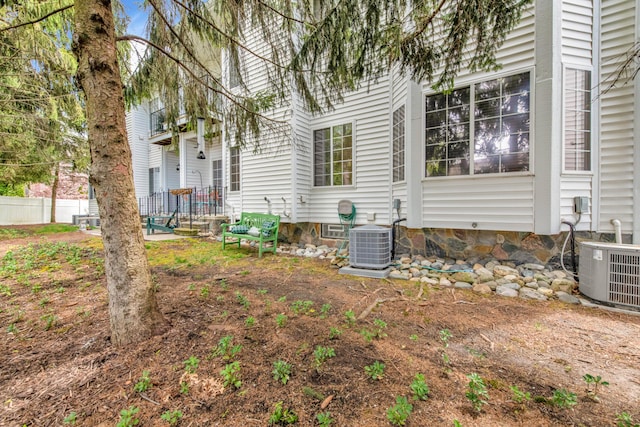 1704 Cassady Place Dr, Plymouth, MI 48170 - view of property exterior featuring central AC and fence