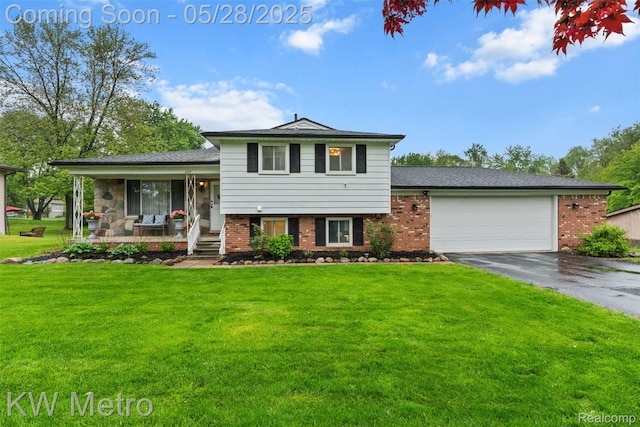 207 Old Perch Rd, Rochester Hills, MI 48309 - tri-level home with driveway, a garage, covered porch, and brick siding