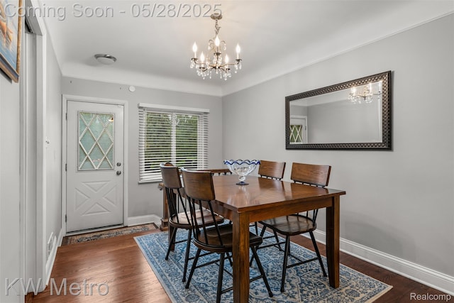 207 Old Perch Rd, Rochester Hills, MI 48309 - dining space with a chandelier, baseboards, and wood finished floors