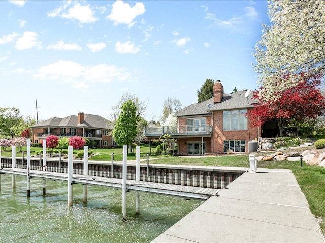 3744 Riverview Ter N, East China, MI 48054 - dock featuring a water view, central AC unit, and a lawn
