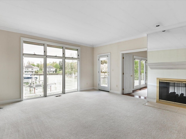 3744 Riverview Ter N, East China, MI 48054 - unfurnished living room featuring carpet floors, a tiled fireplace, ornamental molding, and baseboards