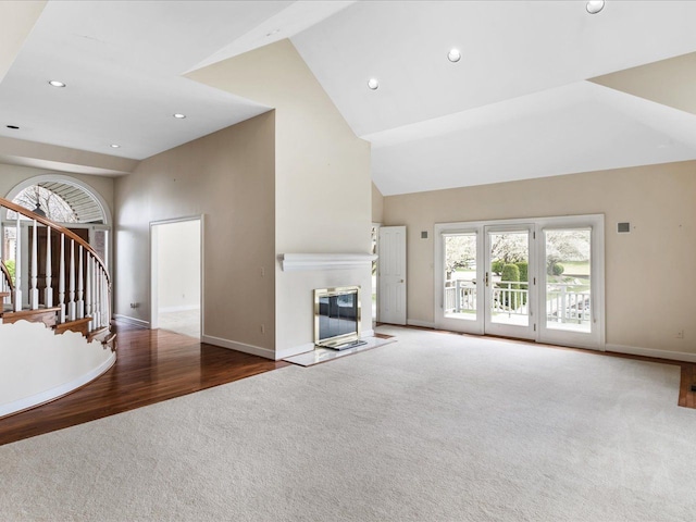 3744 Riverview Ter N, East China, MI 48054 - unfurnished living room with carpet floors, baseboards, high vaulted ceiling, stairway, and recessed lighting