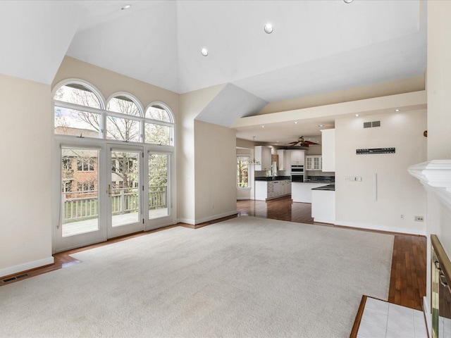 3744 Riverview Ter N, East China, MI 48054 - unfurnished living room featuring high vaulted ceiling, ceiling fan, baseboards, wood finished floors, and recessed lighting