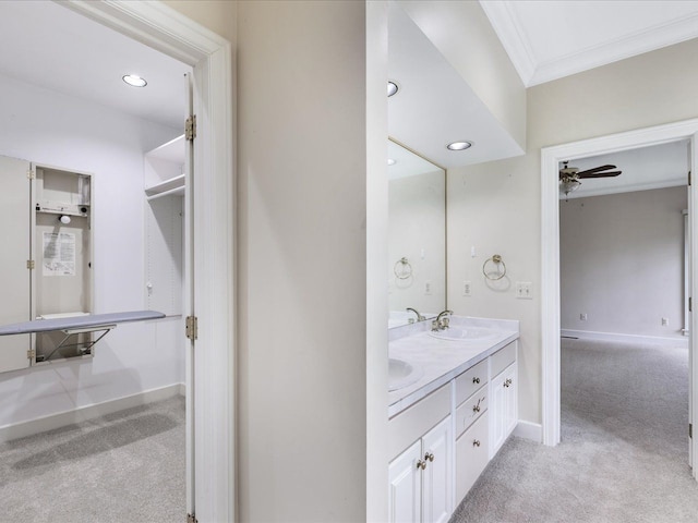 3744 Riverview Ter N, East China, MI 48054 - bathroom with ornamental molding, a ceiling fan, baseboards, double vanity, and recessed lighting