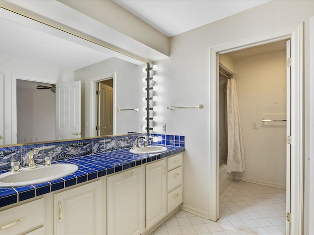 3744 Riverview Ter N, East China, MI 48054 - full bathroom with tile patterned floors, double vanity, shower / bathtub combination with curtain, a ceiling fan, and baseboards