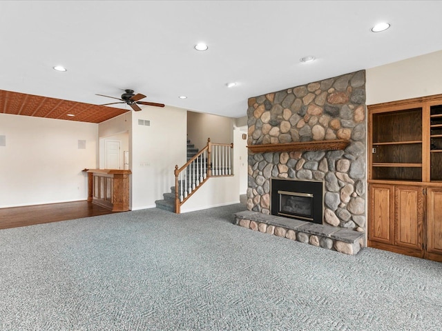 3744 Riverview Ter N, East China, MI 48054 - unfurnished living room with a ceiling fan, carpet flooring, recessed lighting, and a stone fireplace