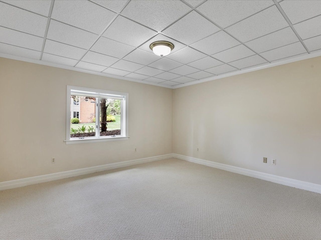 3744 Riverview Ter N, East China, MI 48054 - spare room featuring light carpet, baseboards, ornamental molding, and a paneled ceiling