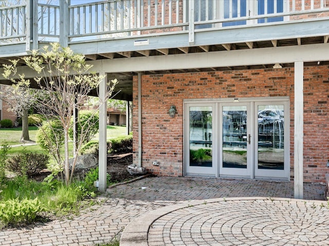 3744 Riverview Ter N, East China, MI 48054 - doorway to property with brick siding, french doors, and a patio area