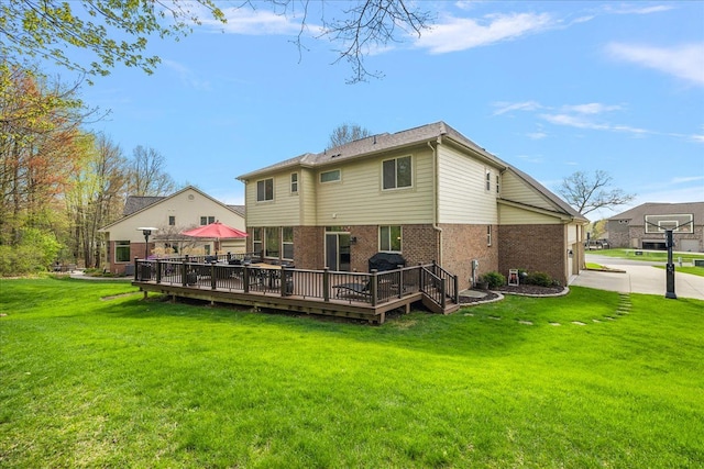 5633 Golf Pointe Dr, Clarkston, MI 48348 - rear view of house with brick siding, a wooden deck, and a lawn