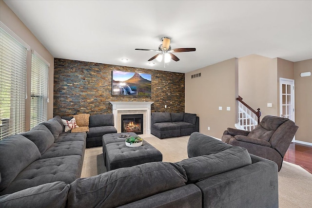 5633 Golf Pointe Dr, Clarkston, MI 48348 - living area featuring a ceiling fan, stairway, and a glass covered fireplace