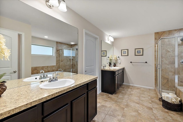 5633 Golf Pointe Dr, Clarkston, MI 48348 - bathroom featuring a shower stall, two vanities, and baseboards